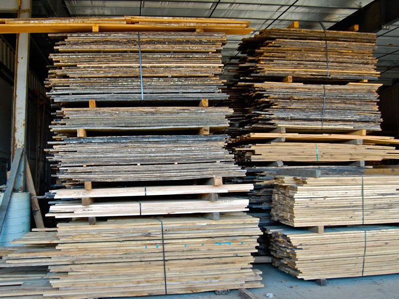 Stacks of reclaimed lumber organized in a wood mill